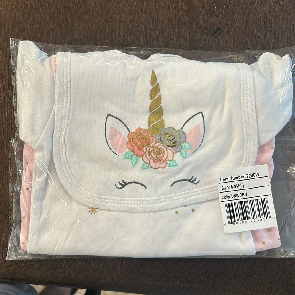 Brand new 3 piece Little Treasures 6-9 month bodysuit, pajama and bib.